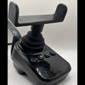 A black plastic joystick control module with a mounting bracket on top and four blue-rimmed buttons on the front face, photographed against a plain light background.